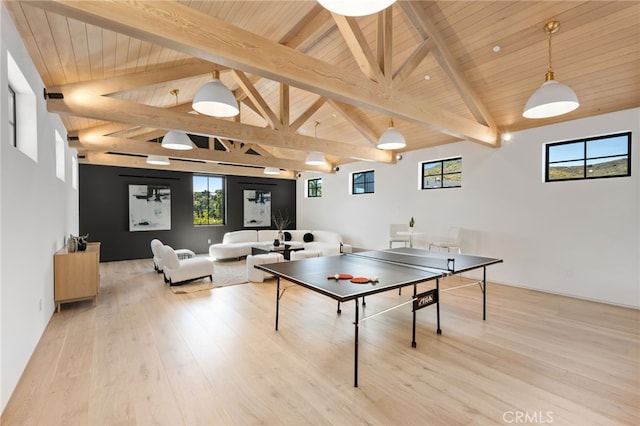 rec room with beam ceiling, wooden ceiling, plenty of natural light, and light wood finished floors