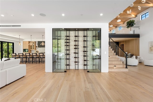 wine area with wood finished floors and recessed lighting