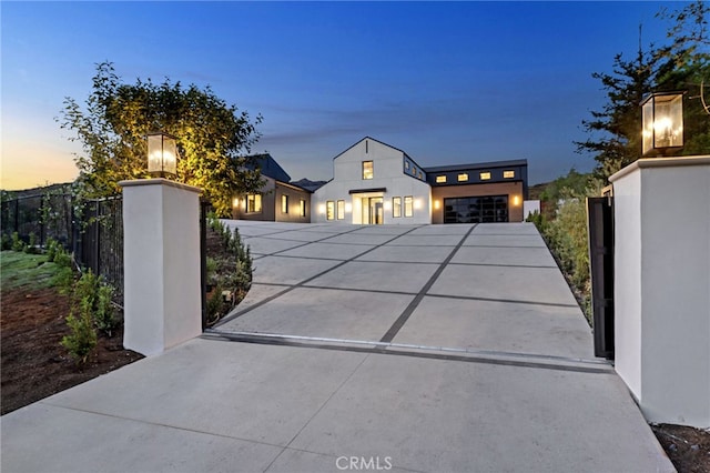 view of gate with a fenced front yard