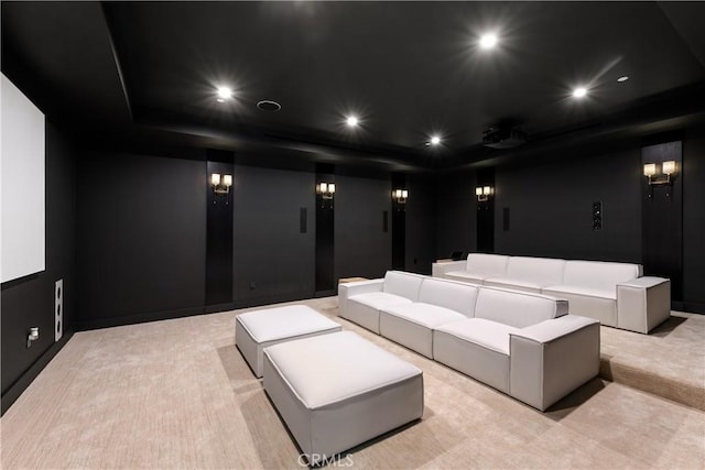 cinema with recessed lighting and light colored carpet