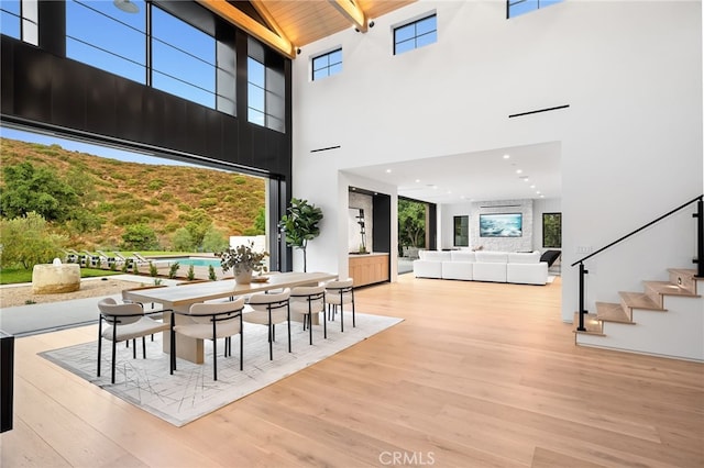 view of patio / terrace with an outdoor hangout area, outdoor dining space, a wooden deck, and an outdoor pool