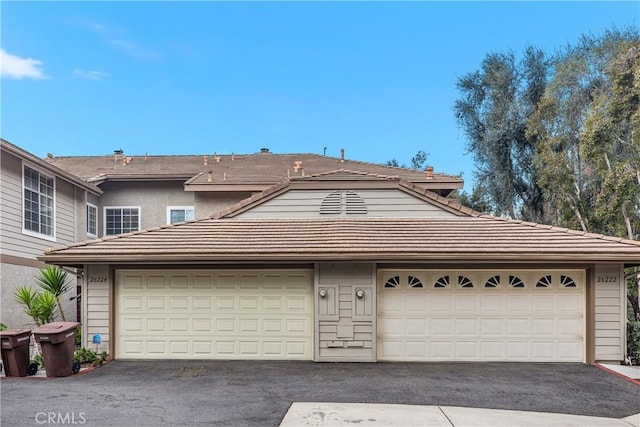 garage with aphalt driveway