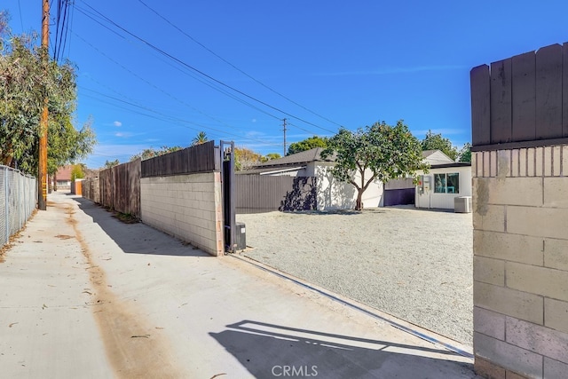 view of yard featuring fence and cooling unit