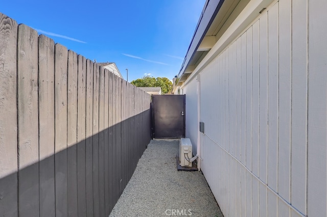 view of property exterior with ac unit and a fenced backyard