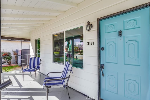 doorway to property featuring a porch