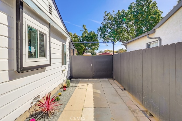 exterior space featuring a gate and fence