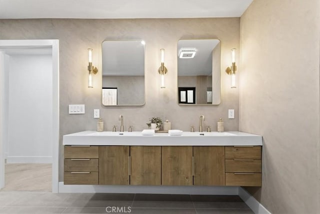 bathroom featuring double vanity, tile patterned flooring, a sink, and visible vents