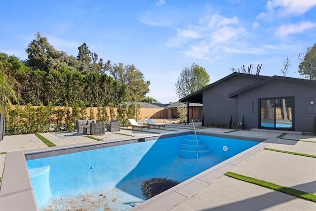 view of pool with a patio area, fence, and a fenced in pool