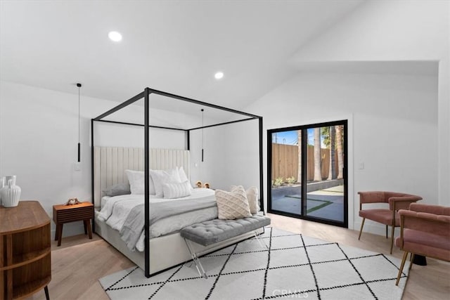 bedroom with access to exterior, light wood-type flooring, vaulted ceiling, and recessed lighting