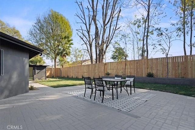 view of patio / terrace featuring outdoor dining area and a fenced backyard