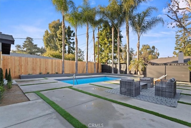 view of pool with a patio area, a fenced backyard, outdoor lounge area, and a fenced in pool