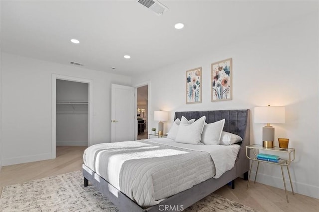 bedroom with baseboards, visible vents, and recessed lighting