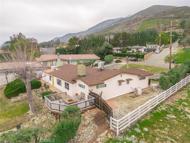 birds eye view of property featuring a mountain view