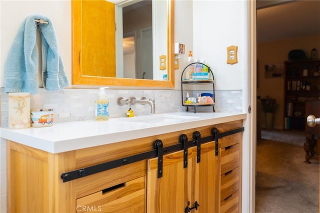 bathroom with backsplash and vanity