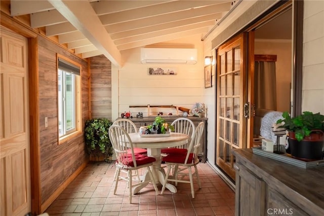 sunroom / solarium with vaulted ceiling and a wall unit AC