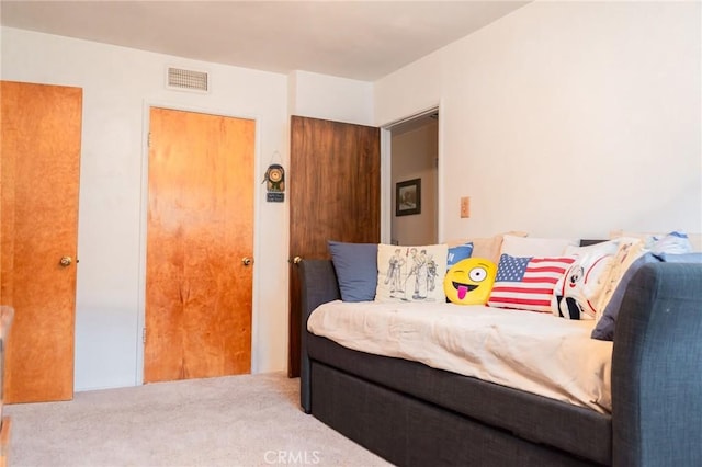 carpeted bedroom with visible vents