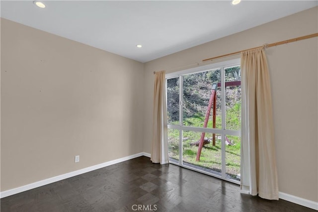 empty room with recessed lighting, plenty of natural light, and baseboards