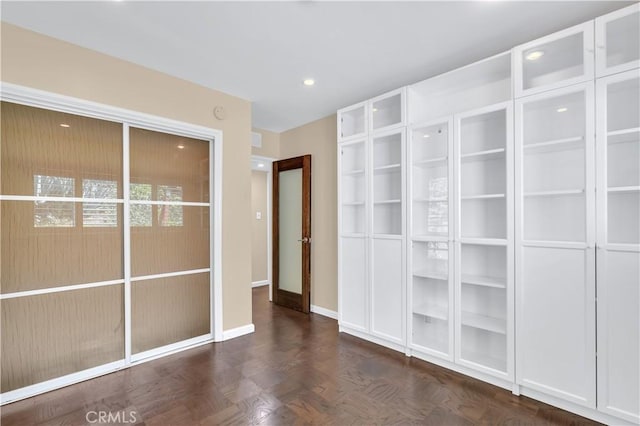 unfurnished bedroom with recessed lighting and baseboards