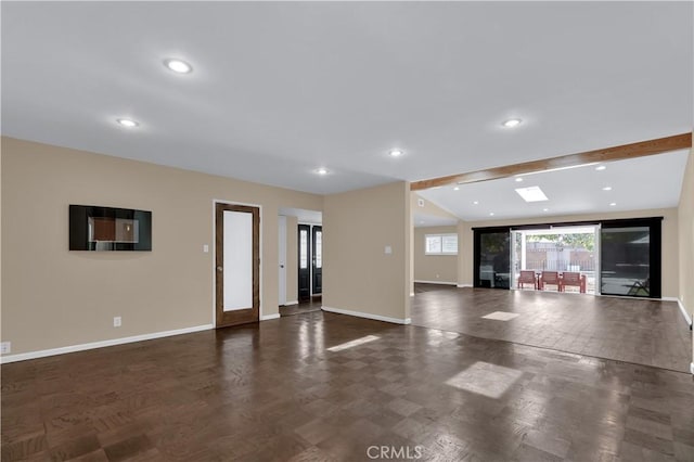 interior space featuring recessed lighting, beam ceiling, and baseboards