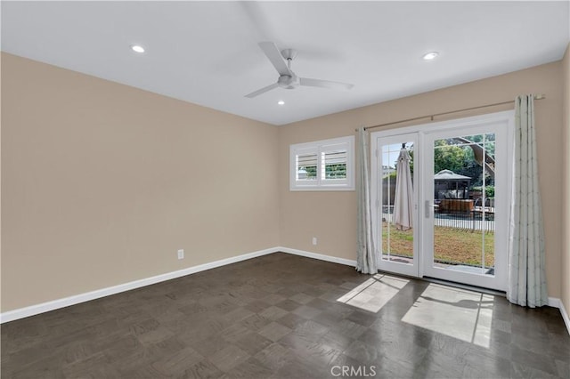 empty room with recessed lighting and baseboards