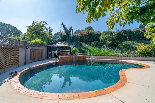 view of swimming pool with a fenced in pool, fence, and a gazebo