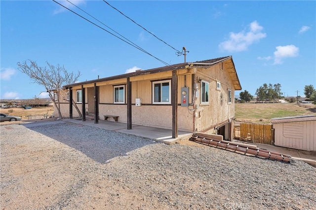 exterior space with a patio area and fence