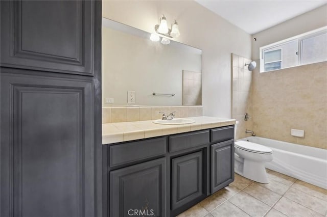 full bathroom featuring shower / washtub combination, vanity, toilet, and tile patterned floors