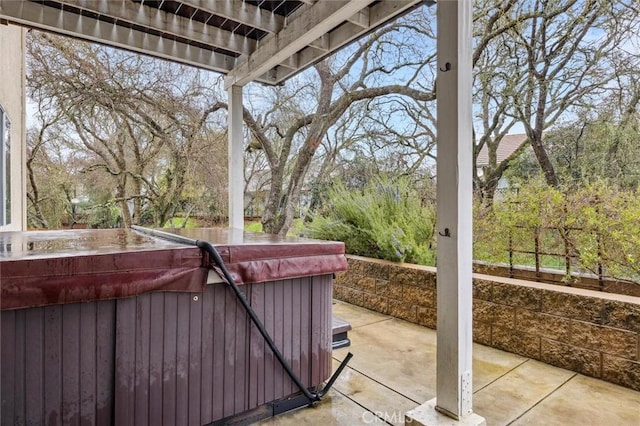 view of patio / terrace with a hot tub