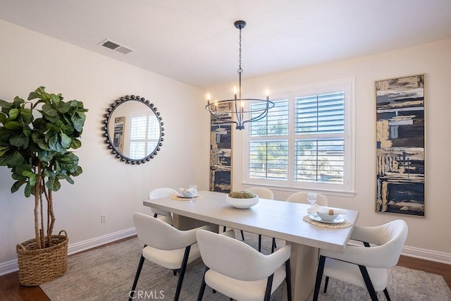25663 Elmwood Ln, Valencia, CA 91381 - dining space featuring visible vents, baseboards, an inviting chandelier, and dark wood finished floors
