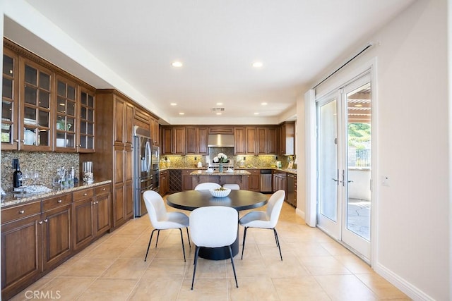 dining area with french doors, recessed lighting, visible vents, light tile patterned flooring, and baseboards