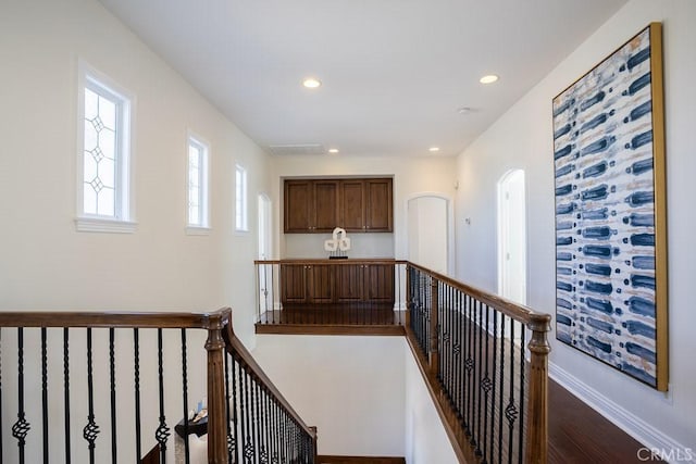 25663 Elmwood Ln, Valencia, CA 91381 - hallway with visible vents, an upstairs landing, recessed lighting, and dark wood finished floors