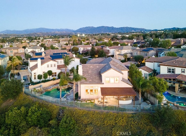 drone / aerial view with a residential view and a mountain view