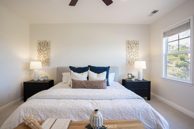 bedroom with visible vents, carpet flooring, a ceiling fan, and baseboards