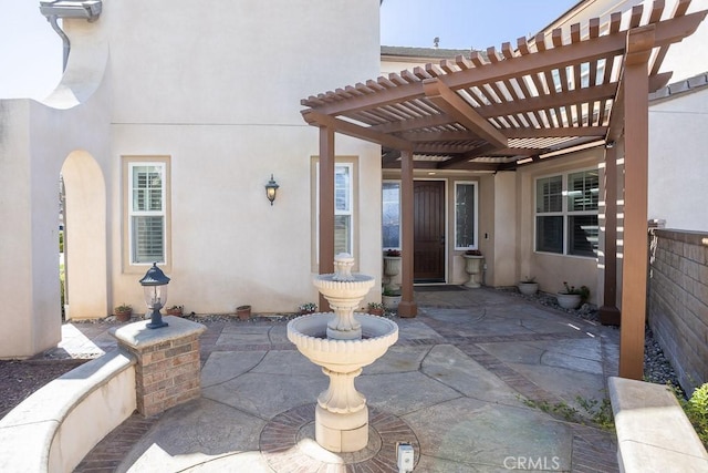 view of patio / terrace featuring fence and a pergola