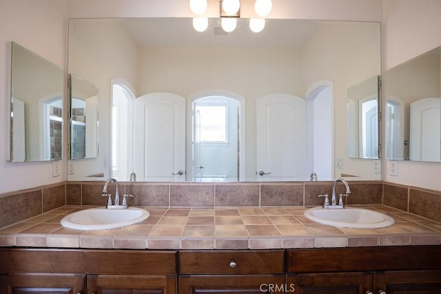 bathroom with double vanity and a sink