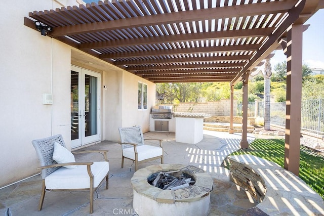 view of patio featuring a fire pit, grilling area, fence, french doors, and a pergola