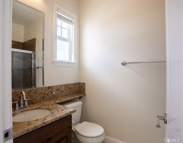 full bath with toilet, a shower stall, and vanity