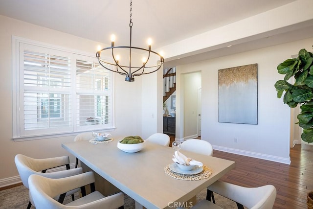 25663 Elmwood Ln, Valencia, CA 91381 - dining space featuring stairway, dark wood-type flooring, a notable chandelier, and baseboards
