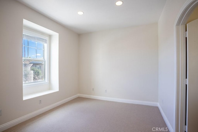 spare room with recessed lighting, carpet flooring, and baseboards