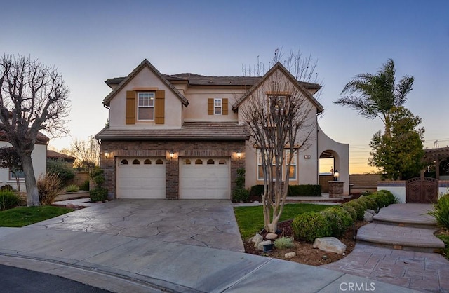 25663 Elmwood Ln, Valencia, CA 91381 - view of front of house featuring concrete driveway, a garage, and stucco siding
