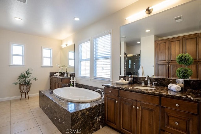 25663 Elmwood Ln, Valencia, CA 91381 - bathroom featuring a bath, a sink, visible vents, and plenty of natural light