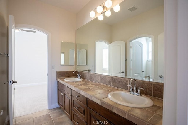 25663 Elmwood Ln, Valencia, CA 91381 - full bathroom featuring double vanity, a sink, tile patterned flooring, and visible vents