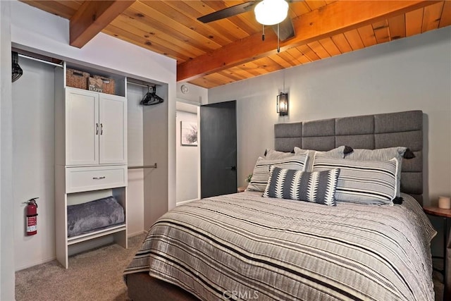 bedroom with wooden ceiling, beam ceiling, and carpet flooring