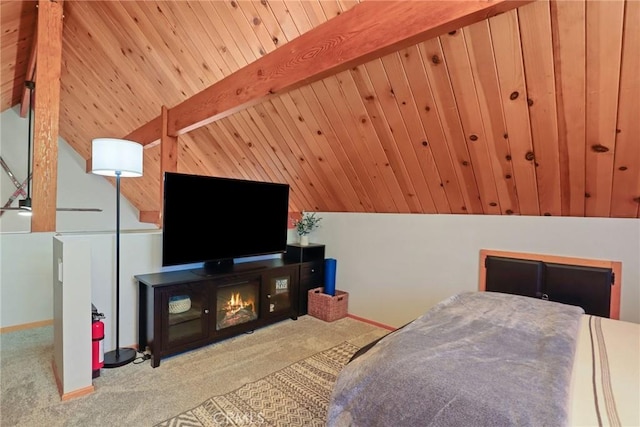 bedroom with vaulted ceiling with beams, carpet floors, and baseboards