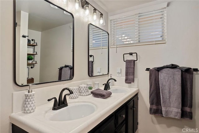 full bath with double vanity and a sink