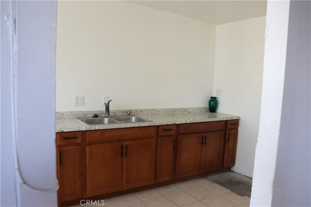 interior space featuring tile patterned flooring and a sink