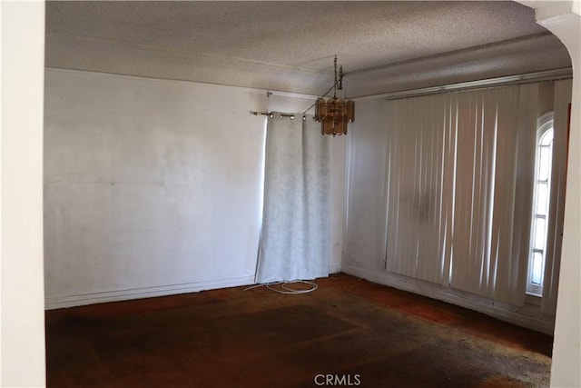 empty room with a textured ceiling