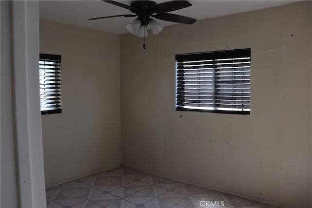 empty room with a ceiling fan