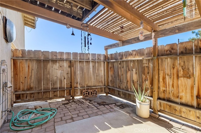 view of patio / terrace featuring fence and a pergola