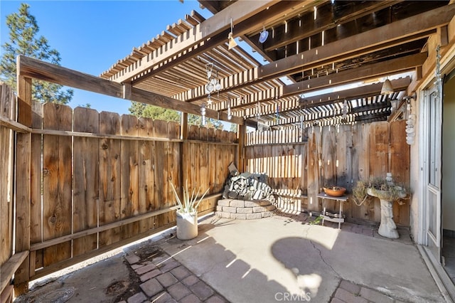 view of patio / terrace featuring fence and a pergola